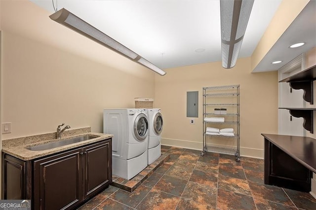 13940 Haystack Ln, Milton, GA 30004 - washroom featuring washer and clothes dryer, stone tile floors, electric panel, and cabinet space
