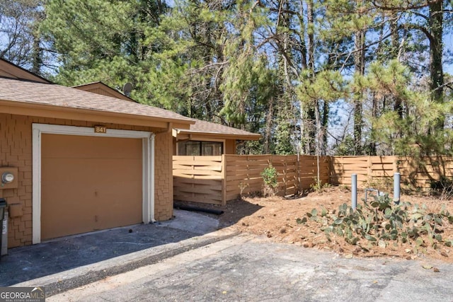 garage featuring fence