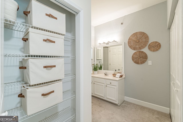 bathroom featuring vanity and baseboards