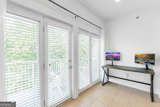 doorway featuring light tile patterned floors