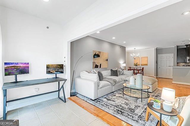 living area with baseboards, ornamental molding, a chandelier, and recessed lighting