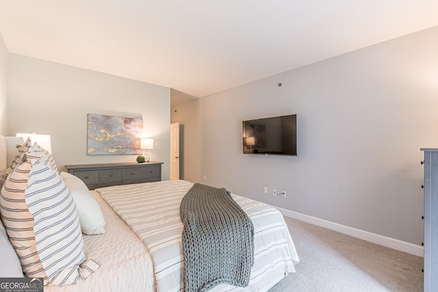 carpeted bedroom with baseboards