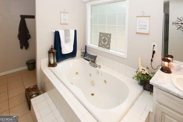 full bathroom with vanity, a tub with jets, and tile patterned floors