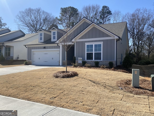 view of front of property featuring a garage, brick siding, driveway, roof with shingles, and board and batten siding