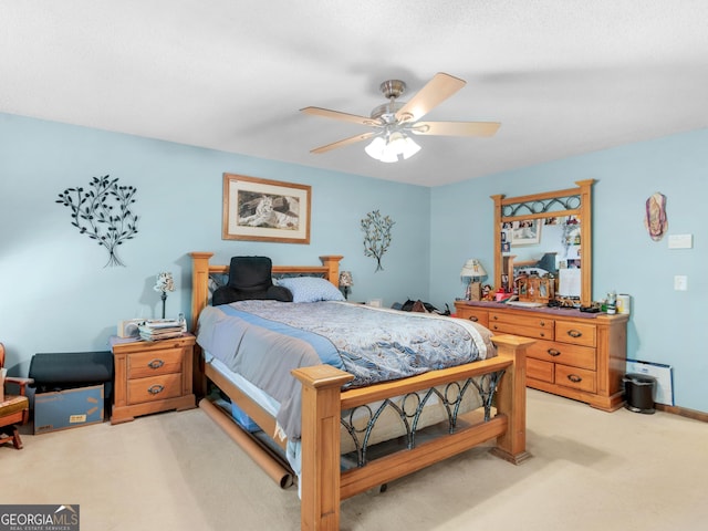 carpeted bedroom featuring a ceiling fan