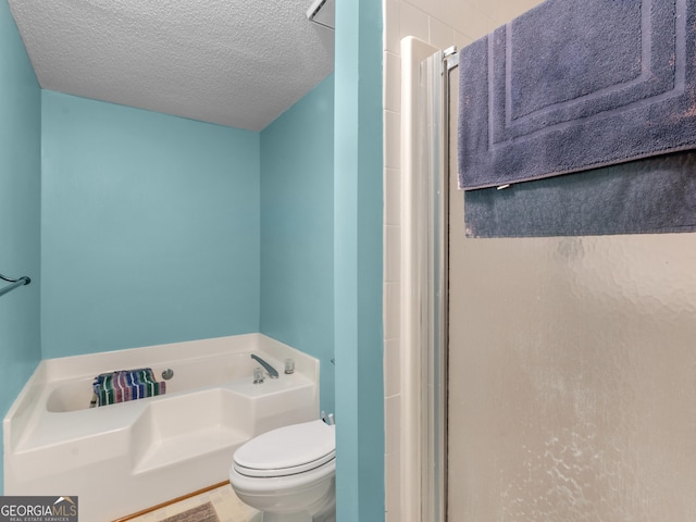 full bath with a stall shower, a garden tub, a textured ceiling, and toilet