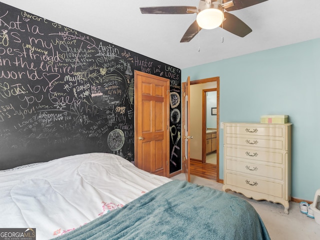 bedroom with ceiling fan and baseboards