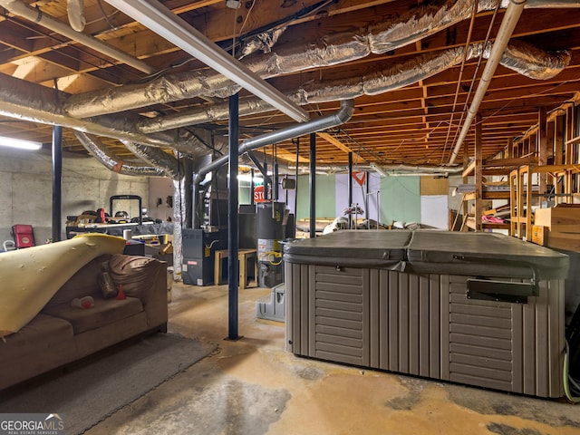 unfinished basement featuring water heater