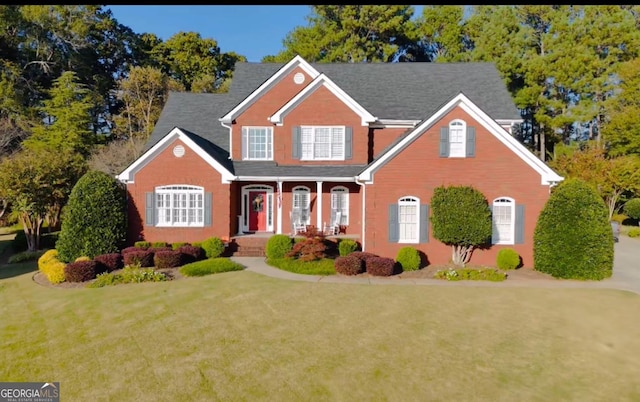 3585 Shepherds Ln, Loganville, GA 30052 - traditional-style home with covered porch and a front lawn