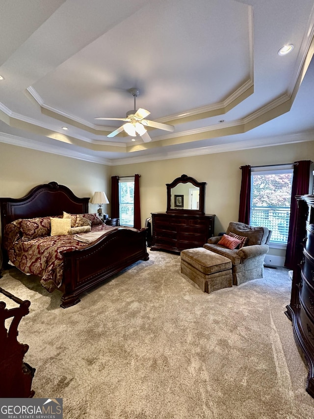 3585 Shepherds Ln, Loganville, GA 30052 - bedroom featuring carpet floors, a tray ceiling, multiple windows, and ornamental molding
