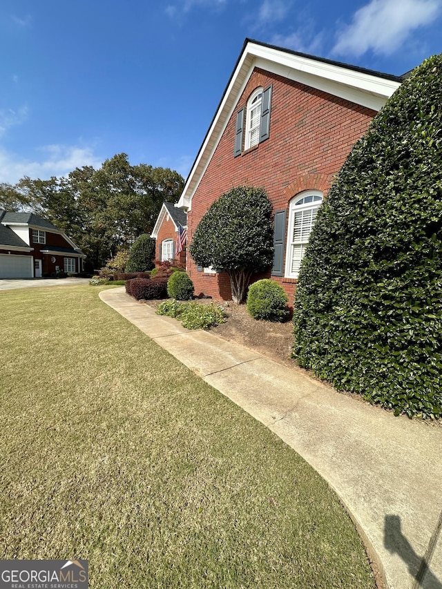 3585 Shepherds Ln, Loganville, GA 30052 - view of home's exterior featuring a yard and brick siding