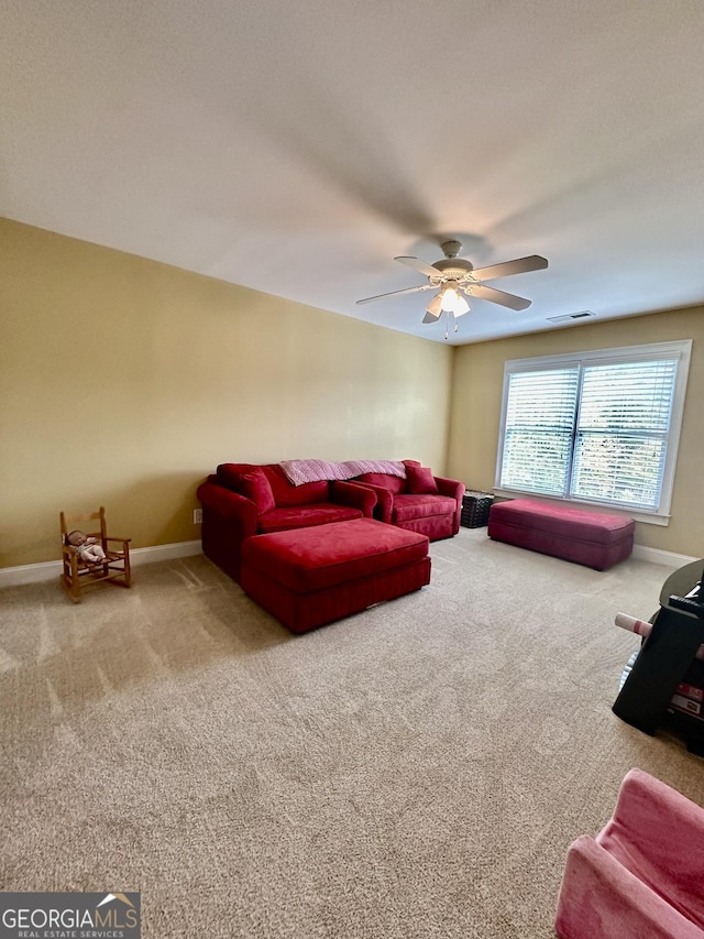 3585 Shepherds Ln, Loganville, GA 30052 - carpeted living room with a ceiling fan, visible vents, and baseboards