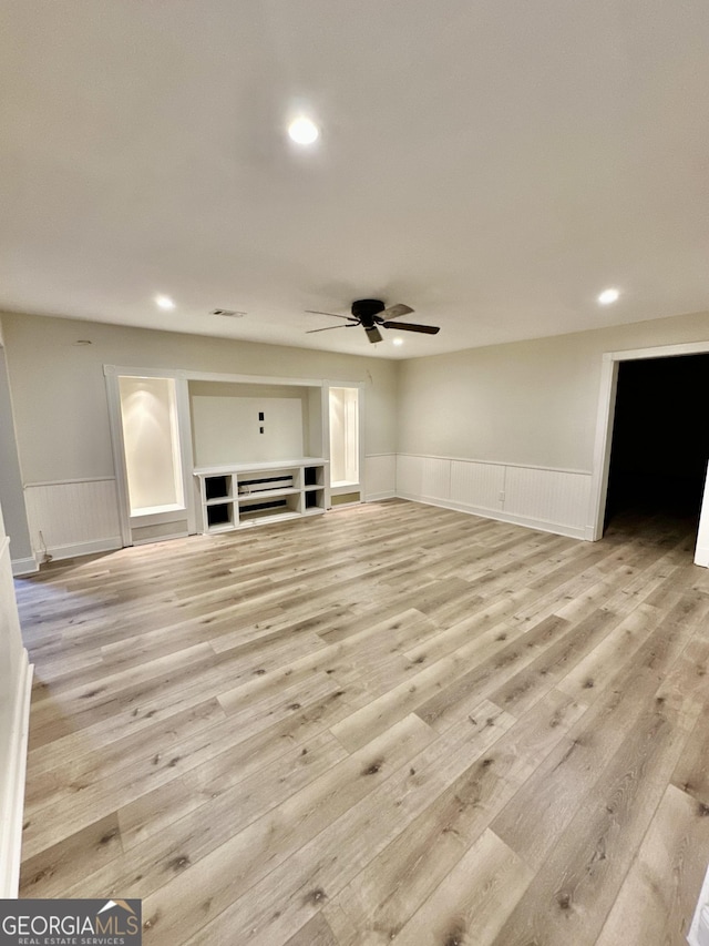 3585 Shepherds Ln, Loganville, GA 30052 - unfurnished living room featuring wainscoting, wood finished floors, and recessed lighting