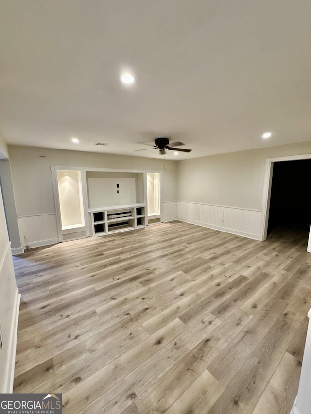 3585 Shepherds Ln, Loganville, GA 30052 - unfurnished living room with wainscoting, light wood-style flooring, and recessed lighting