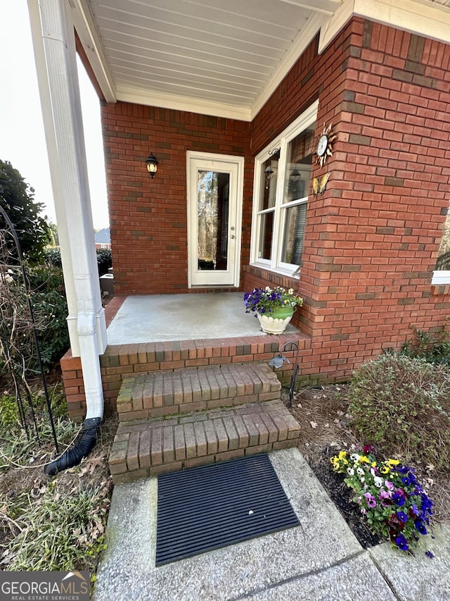 3585 Shepherds Ln, Loganville, GA 30052 - entrance to property featuring covered porch and brick siding