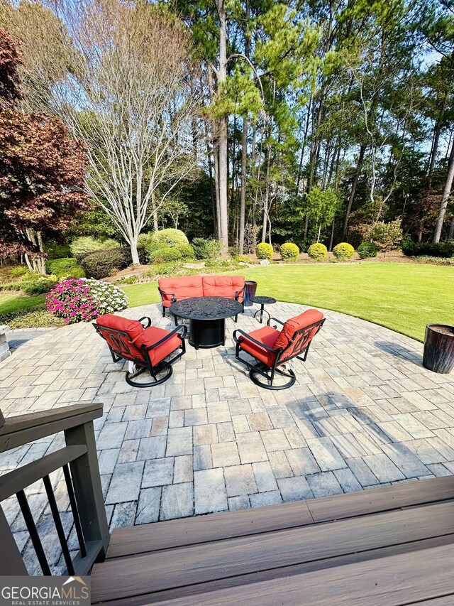 3585 Shepherds Ln, Loganville, GA 30052 - view of patio featuring an outdoor fire pit