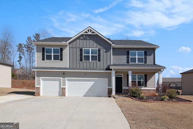 craftsman-style house with board and batten siding, concrete driveway, a porch, and an attached garage