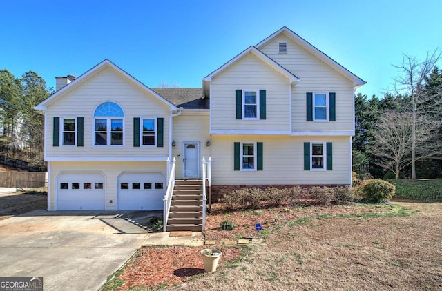 view of front of property featuring driveway and an attached garage