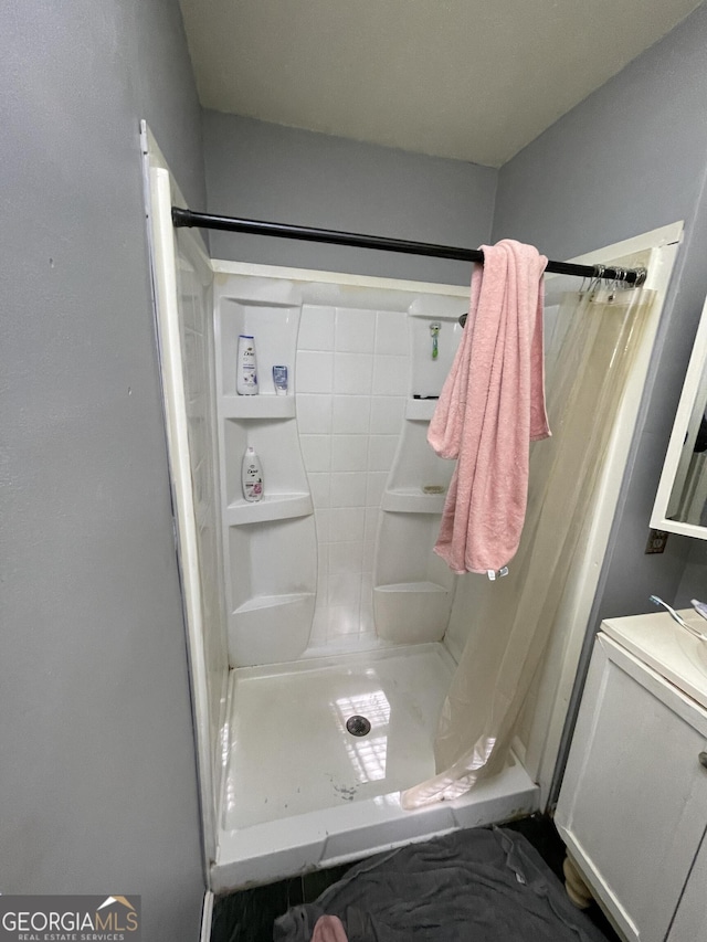 bathroom with a shower stall