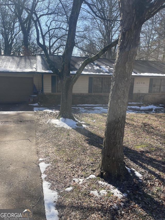 view of side of home with an attached garage