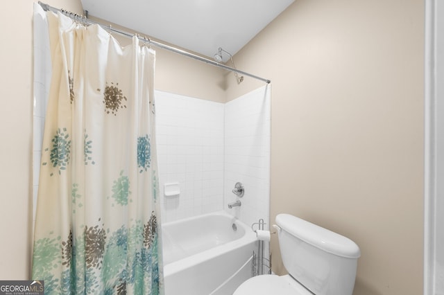 bathroom with toilet and shower / bath combo with shower curtain