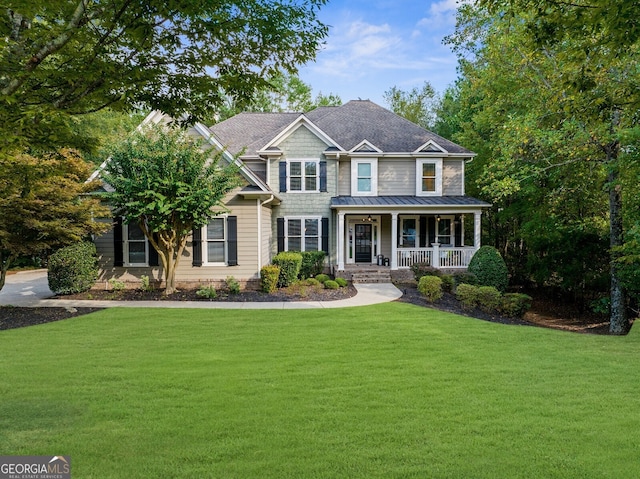 view of front facade with a porch and a front yard