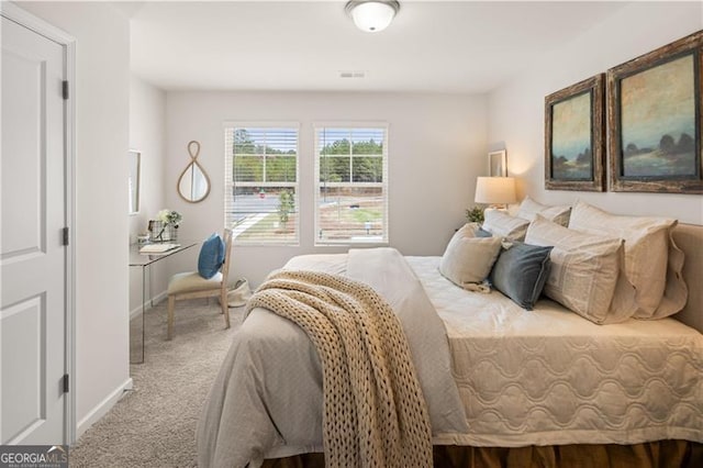 bedroom with carpet and baseboards