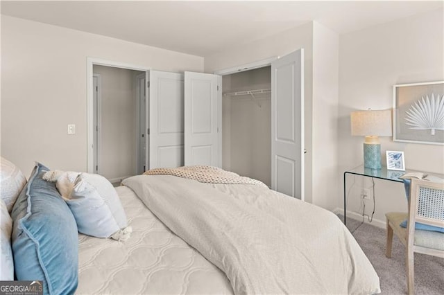 carpeted bedroom featuring a closet