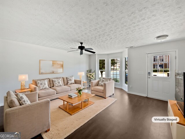 11403 S Grove Dr, Hampton, GA 30228 - living area featuring dark wood-style floors, a textured ceiling, and ceiling fan