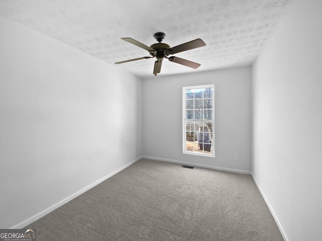 11403 S Grove Dr, Hampton, GA 30228 - carpeted empty room with ceiling fan and a textured ceiling
