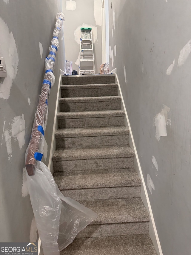 stairway with baseboards