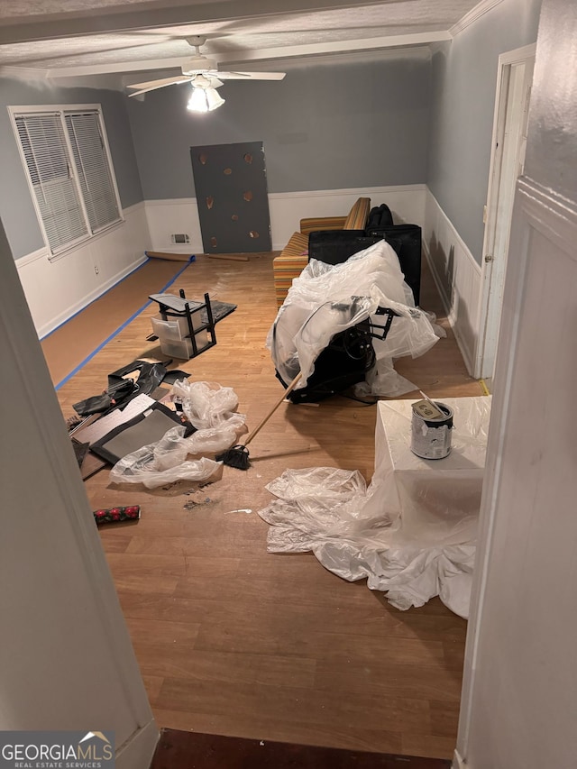 bedroom with a ceiling fan, visible vents, and wood finished floors