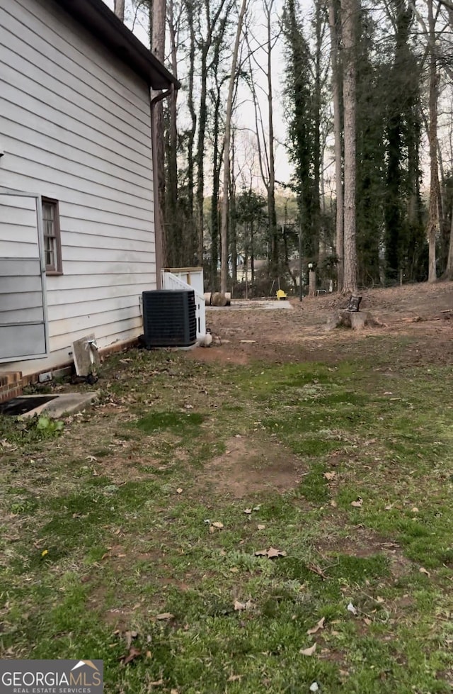 view of yard featuring central AC unit