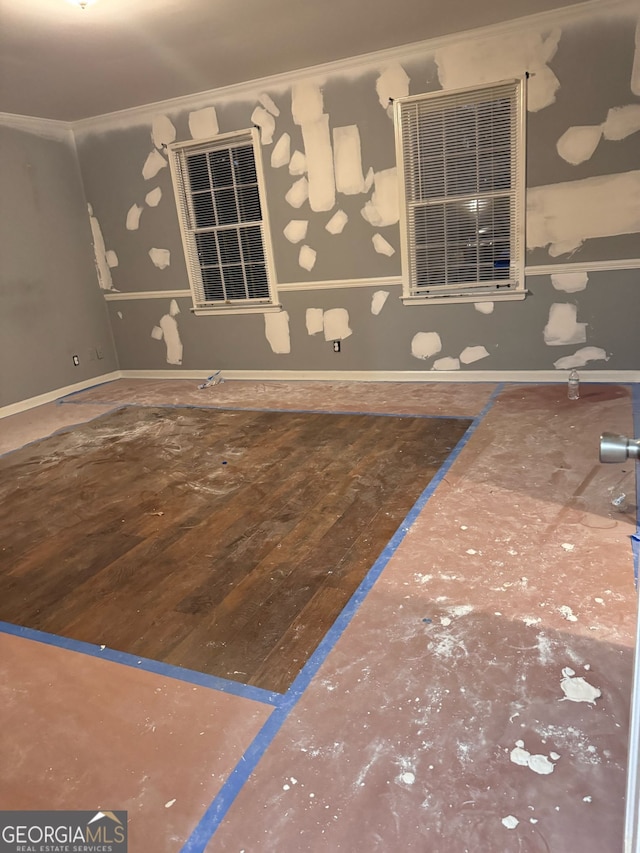 exterior space featuring wood-type flooring, baseboards, and ornamental molding
