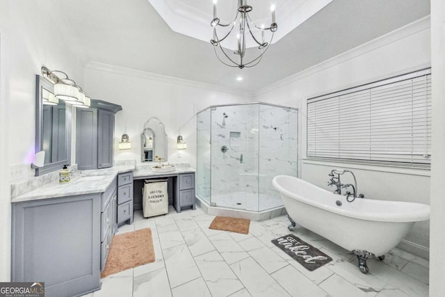 bathroom featuring marble finish floor, a stall shower, crown molding, and vanity