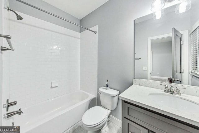 bathroom with  shower combination, baseboards, vanity, and toilet