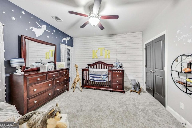 bedroom featuring carpet floors, baseboards, visible vents, and a ceiling fan