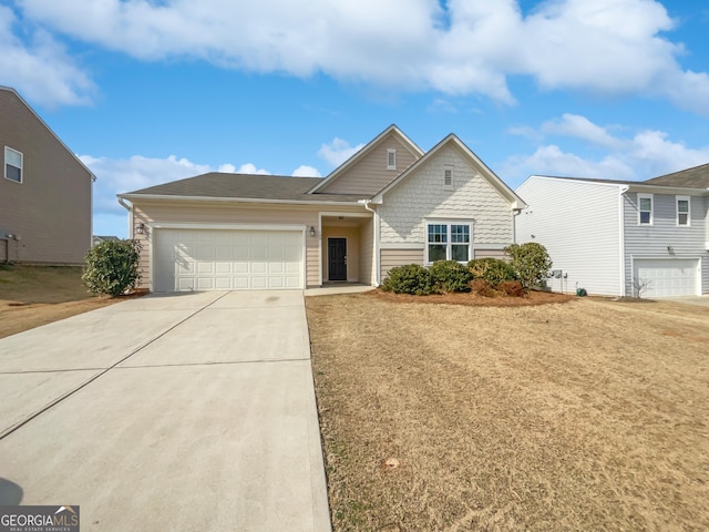 view of front of house featuring driveway and a garage