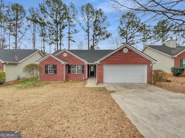 1681 Graystone Dr, Hampton, GA 30228 - view of front facade featuring brick siding, a garage, and concrete driveway