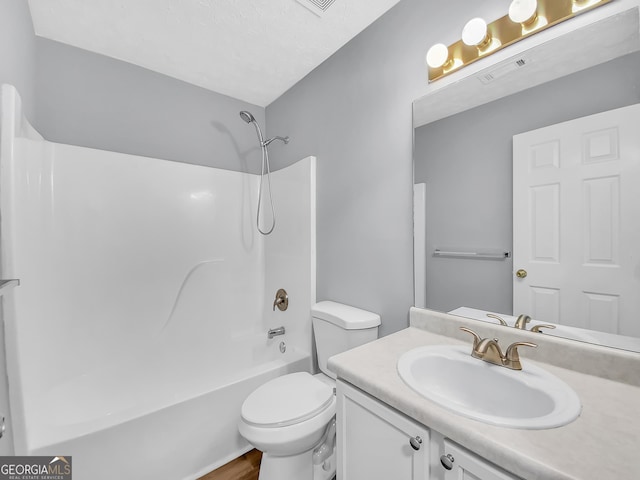 full bath with shower / bathtub combination, visible vents, vanity, and toilet