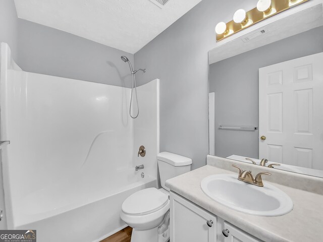 1681 Graystone Dr, Hampton, GA 30228 - full bathroom featuring  shower combination, vanity, and wood finished floors