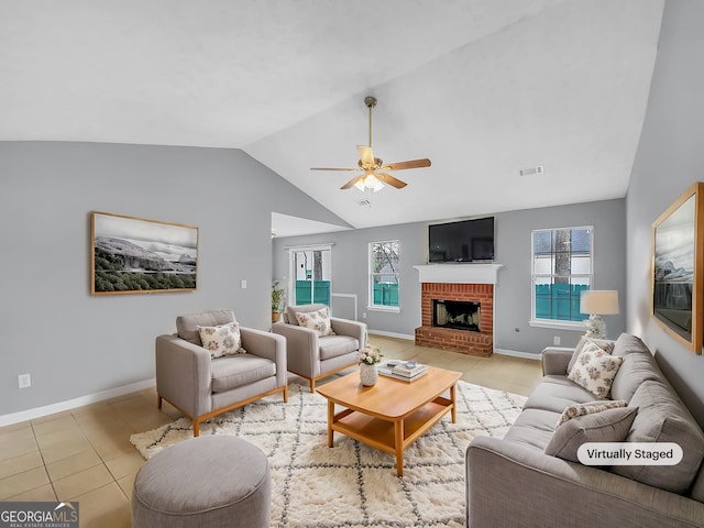 living room featuring light tile patterned flooring, visible vents, and a healthy amount of sunlight