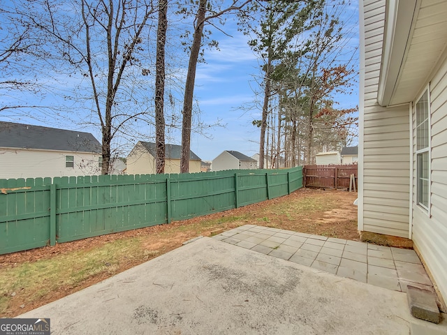 view of yard featuring a patio area and a fenced backyard