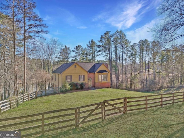 view of front of home with a front lawn and a fenced front yard