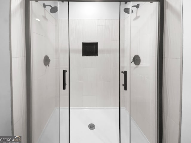 bathroom with a shower stall