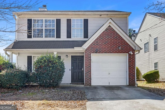 traditional-style home with a garage, concrete driveway, brick siding, and a chimney