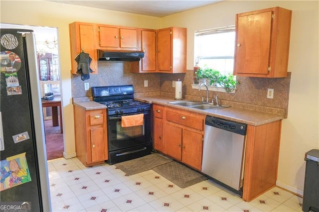 5546 Wellborn Creek Dr, Lithonia, GA 30058 - kitchen with stainless steel appliances, a sink, under cabinet range hood, and tasteful backsplash
