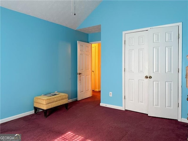 5546 Wellborn Creek Dr, Lithonia, GA 30058 - carpeted bedroom featuring lofted ceiling, baseboards, and a closet