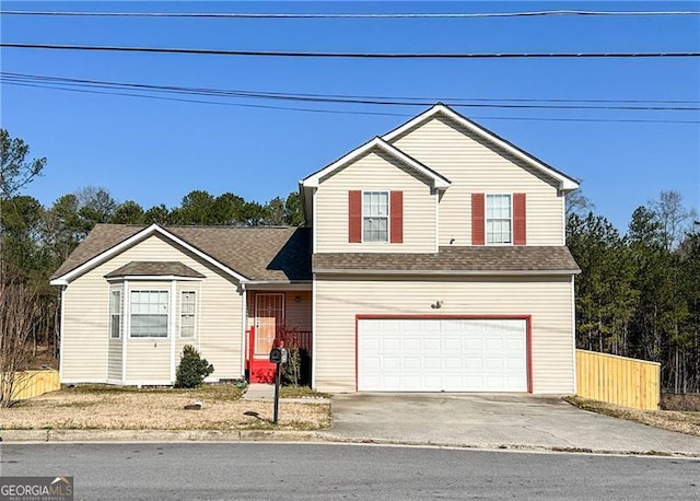 5546 Wellborn Creek Dr, Lithonia, GA 30058 - traditional home featuring an attached garage, concrete driveway, and a shingled roof