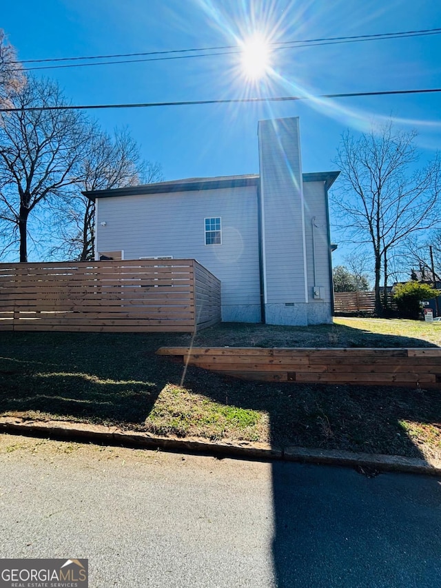 view of side of property featuring crawl space